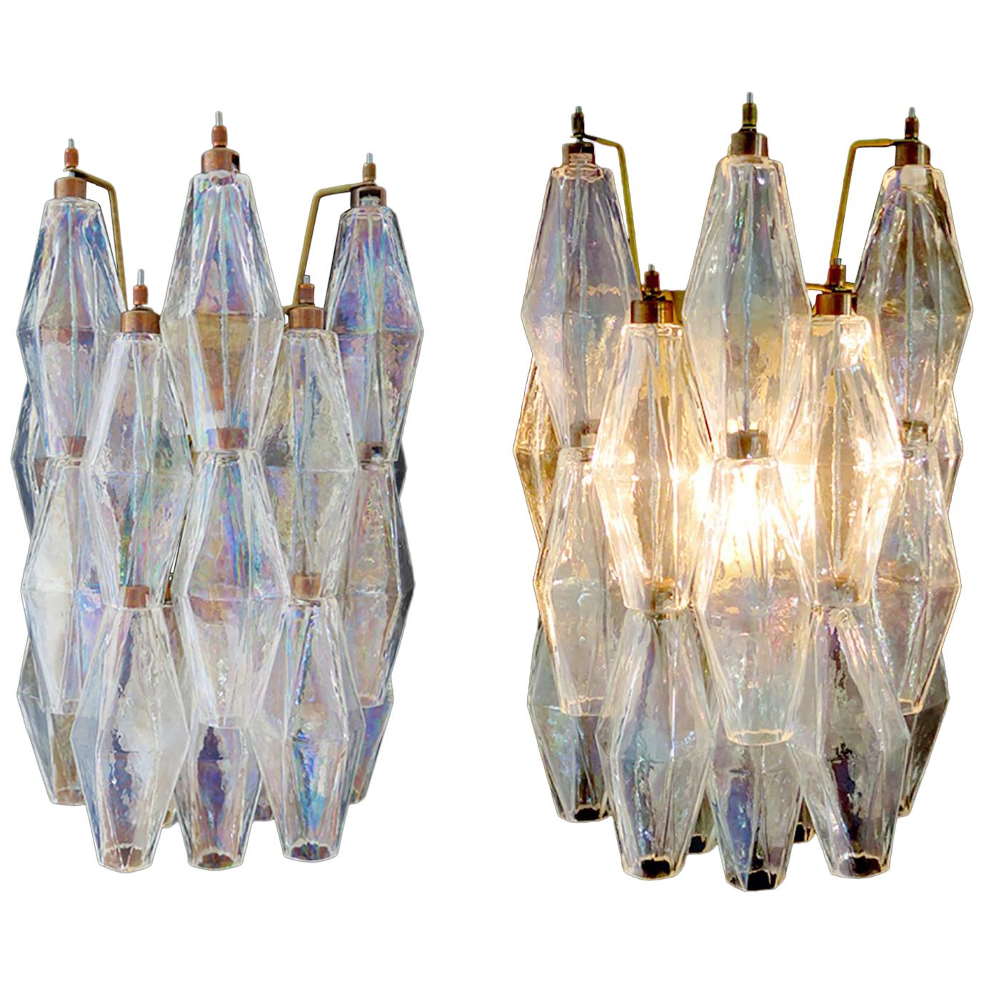 100% handmade in Murano. Each sconce are made by 16 Murano handmade poliedri glass, for each one, in a solid metal frame gold painted and brass. The glasses
are now unavailable, they have the particularity of reflecting a multiplicity of colors,