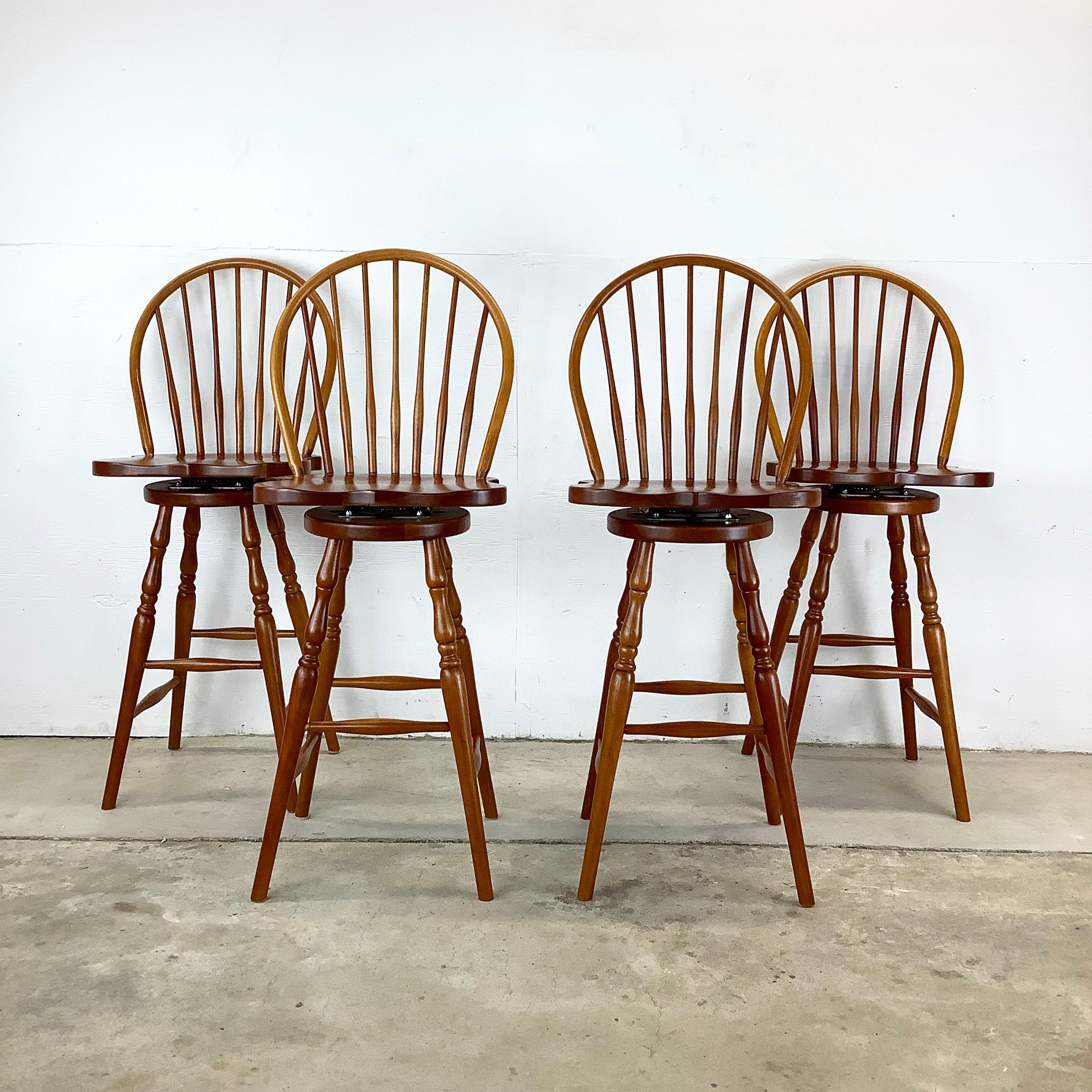Step into the world of bespoke craftsmanship with these Windsor cherry bar stools from Tom Seely furniture, a name synonymous with quality woodworking. Each stool, carefully hewn from rich cherry wood, offers not only a seat but a touch of refined