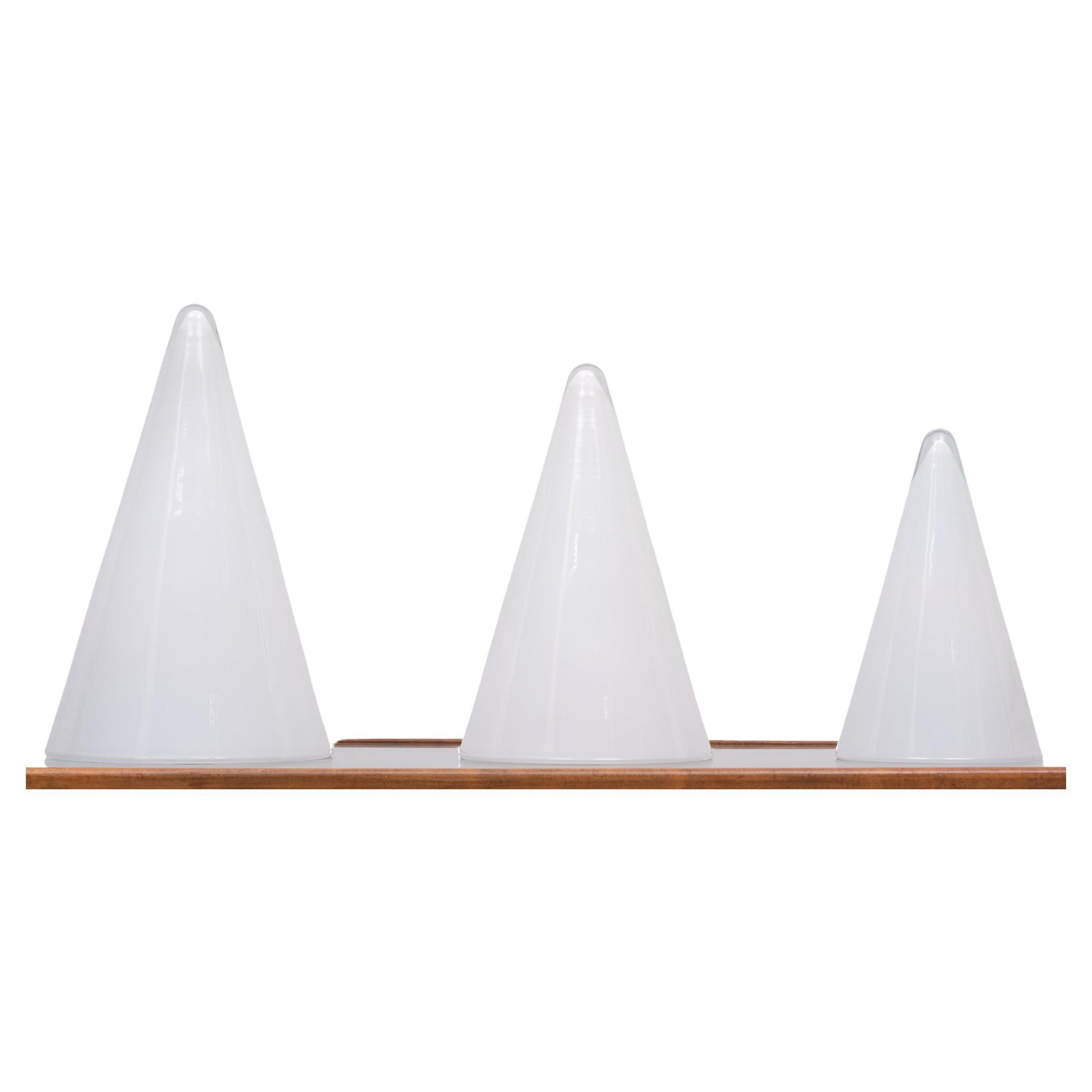 Great looking set off White opal crystal glass conical pyramid style lampshade with a layer of clear glass on the outside, ending clear on top. Three different sizes . Two large sockets one small . Very good condition . all signed 
Manufacturer: