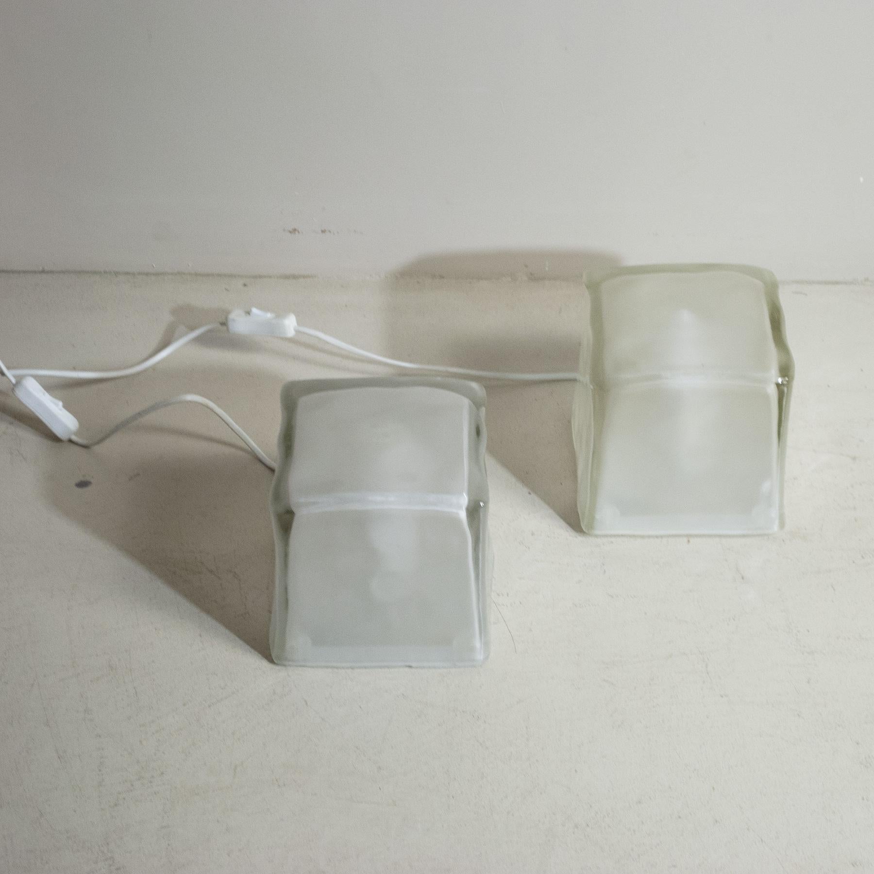 Set of three floor lamps in frosted glass with a cuboid shape.