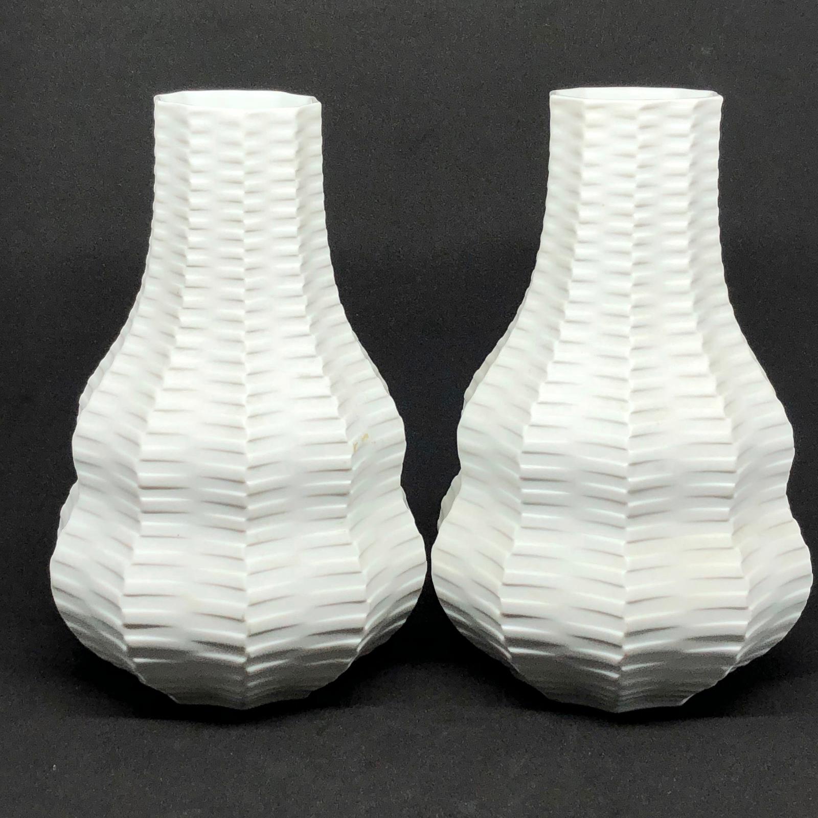 An amazing set of two bisque porcelain midcentury studio art pottery vase made in Germany, by Heinrich Fuchs for Hutschenreuther, circa 1960s. Vases are in very good condition with no chips, cracks, or flea bites. Signed with Manufactory mark and