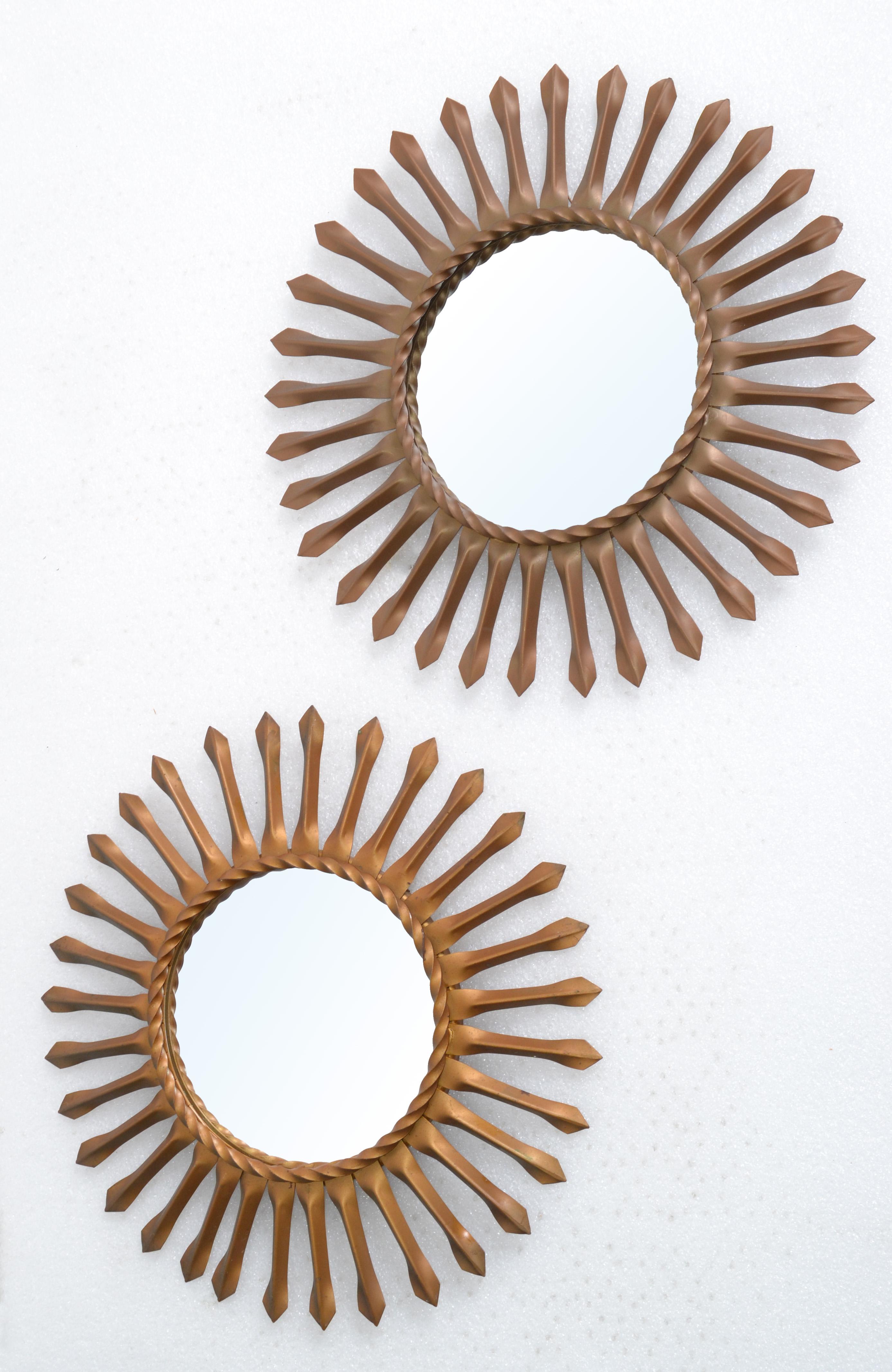 From the South of France are these 2 Sunburst wall mirror signed on the reverse Chaty Vallauris.
In a dark gold finish with a 5.5 inches diameter flat Mirror.
Both are signed on the back.