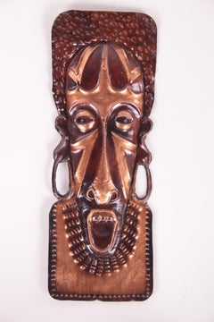 Vintage African hand made copper wall masks from the 60s to the 70s