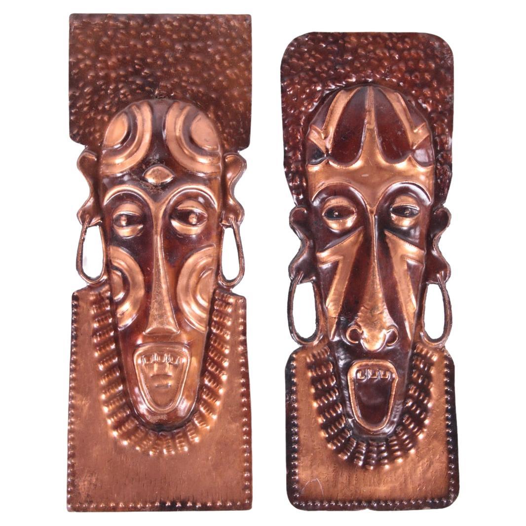 Vintage African hand made copper wall masks from the 60s to the 70s For Sale