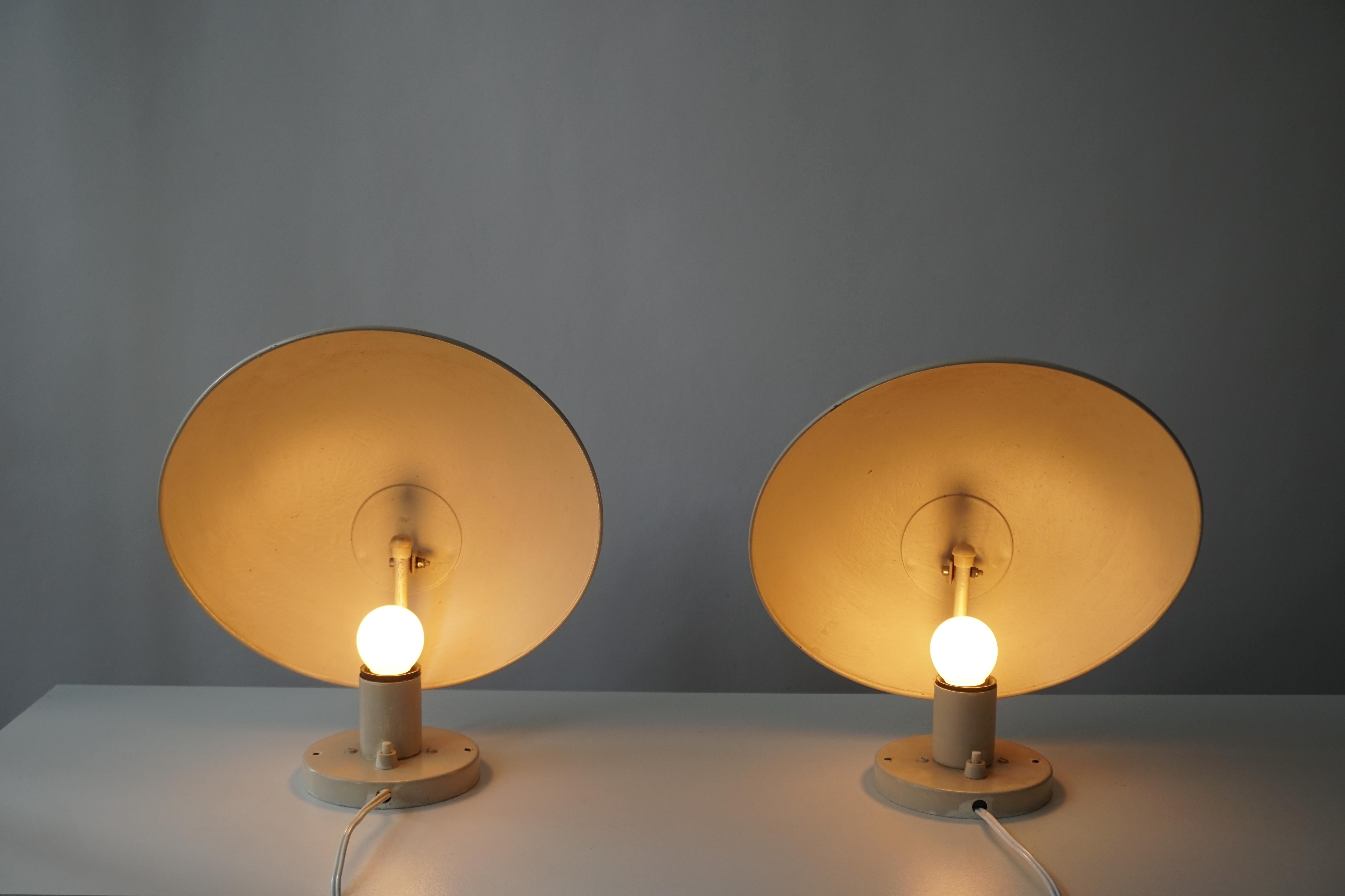 A set of white and pink PH hat wall lamp designed by Poul Henningsen in the late 1970s and manufactured by Louis Poulsen in Denmark. Both labeled with paper-stickers from Louis Poulsen.