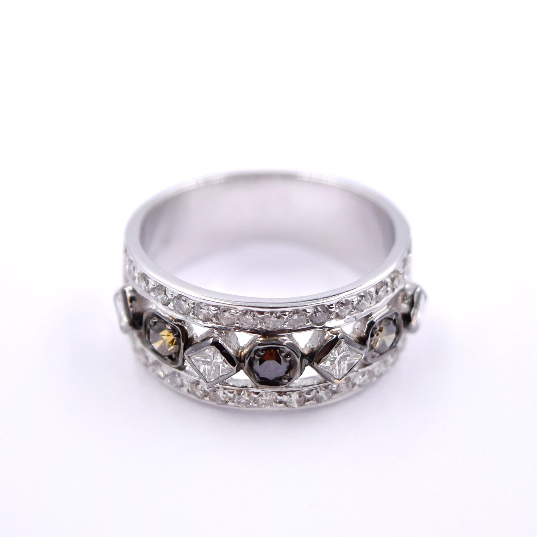 Beautiful multicolored diamond deco band by Sethi Couture.

This ring features a row of multicolored princess cut white diamonds and round diamonds with colors of yellow and brown. Small round white diamonds surround the center row, bringing the