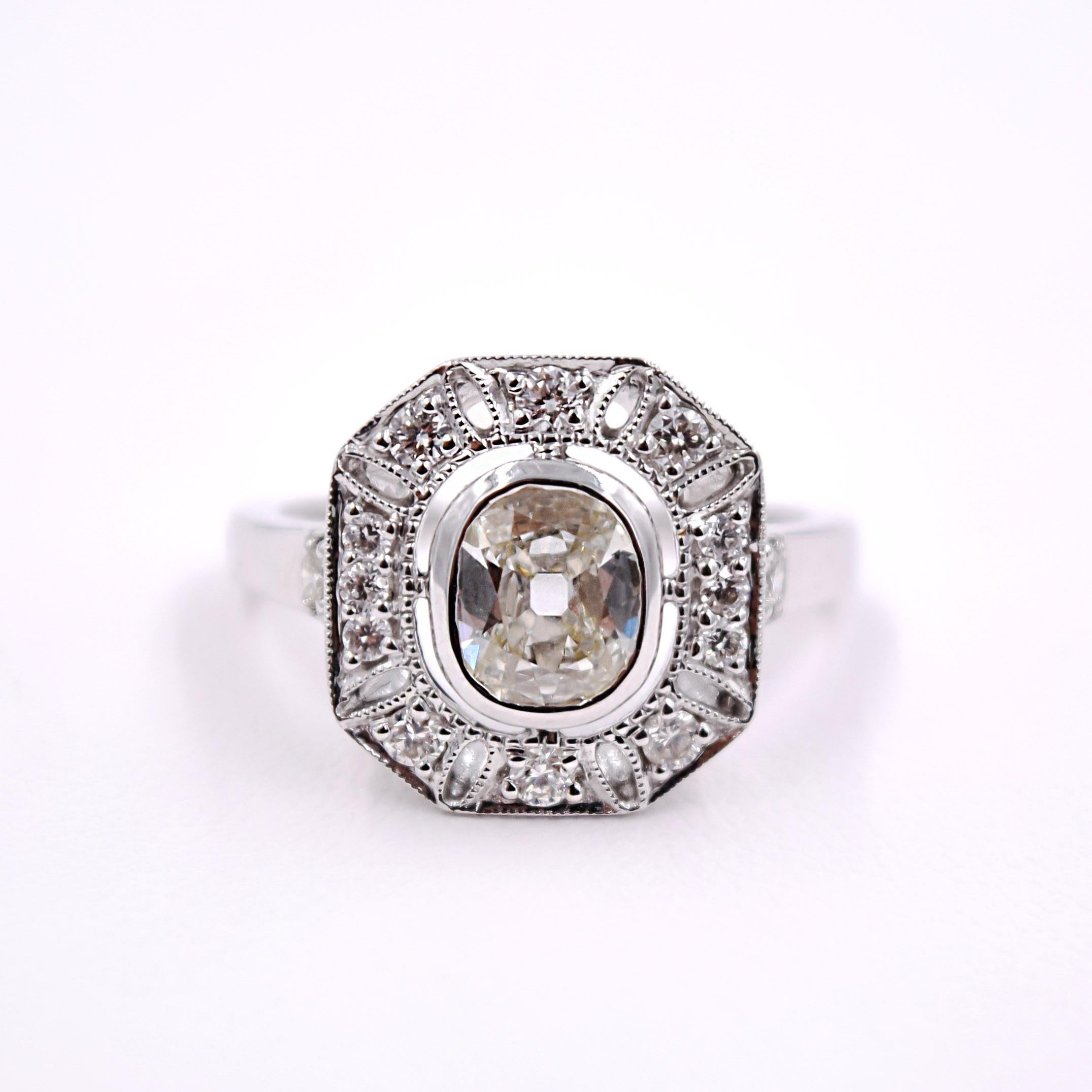 Sethi Couture White Diamond Ring
- White Oval Center Diamond with 14 Small Round Diamonds 1.20 Carats TDW
- 18 Karat White Gold
- Size 6.5 and can be sized
