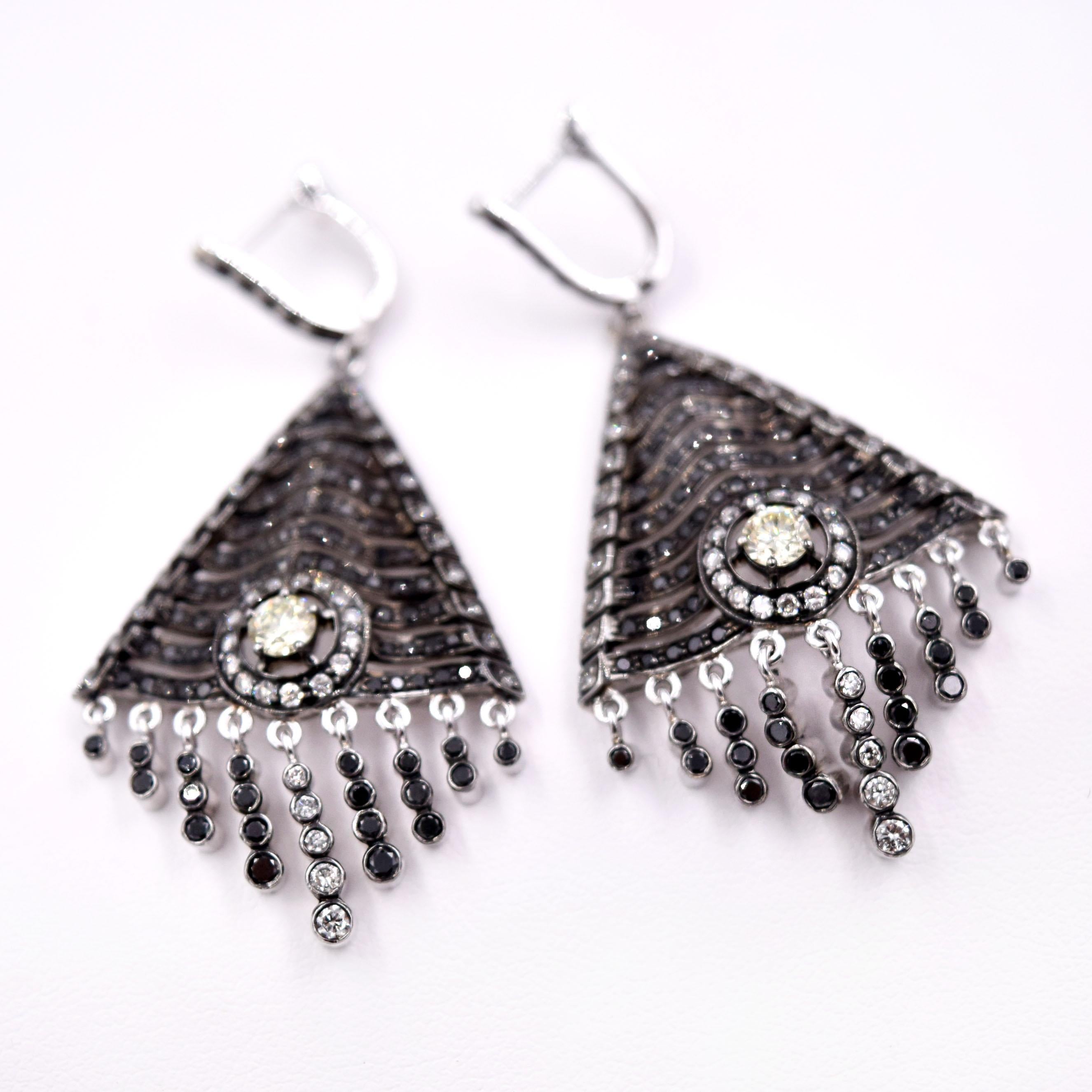 Vintage inspired Black and White Diamond Tassel Earrings designed by Sethi Couture.
3.44 Carats of white and black diamonds are set in 18 Karat white gold and black rhodium accents.
Length of the earring is 2.26