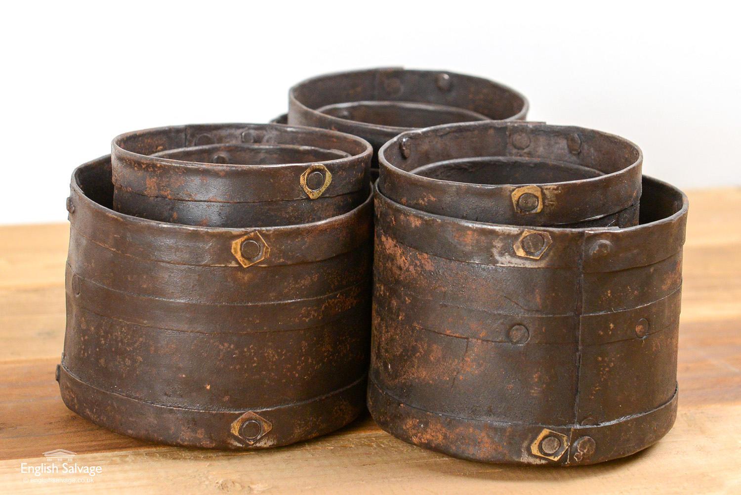 Indian studded iron rice measures. Each set contains a small, medium and large pot, rough sizes of each as follows. The small pots are 8cm diameter x 8cm high. The medium pots are 9.4cm diameter x 9.5cm high. The large pots are 11cm diameter x 8cm