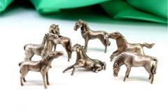 Sets of seven silver horses with perfect reliefs
