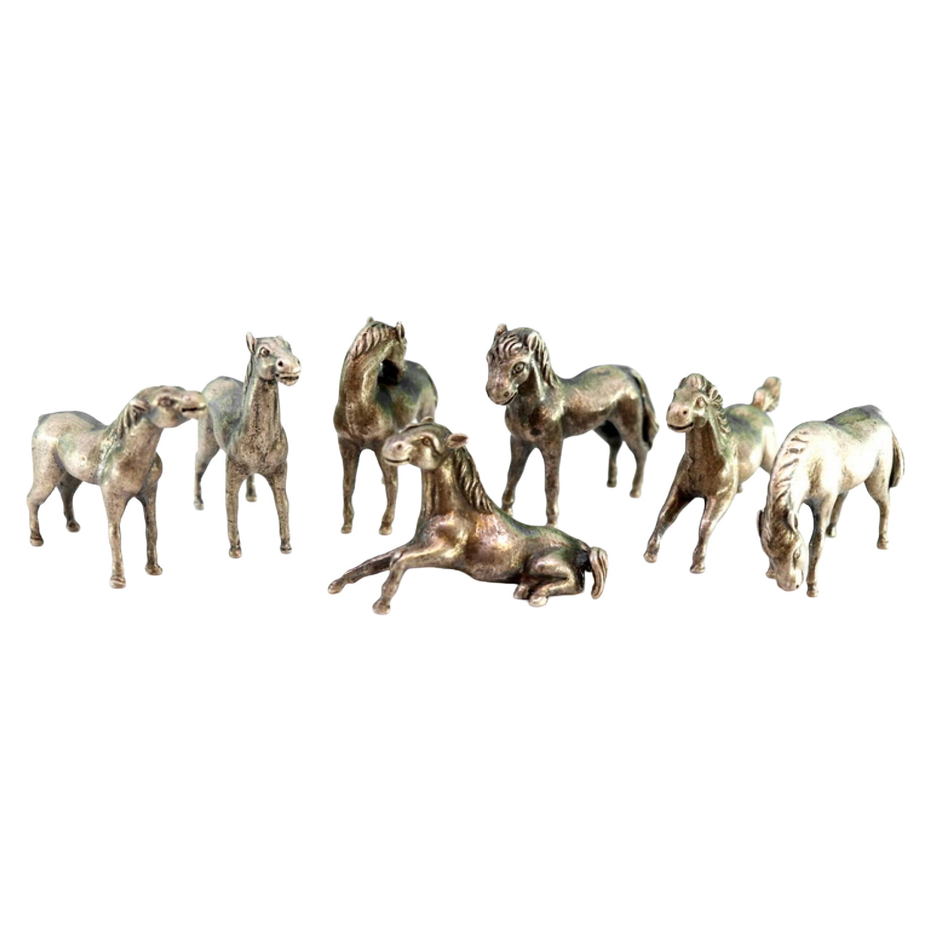 Sets of seven silver horses with perfect reliefs