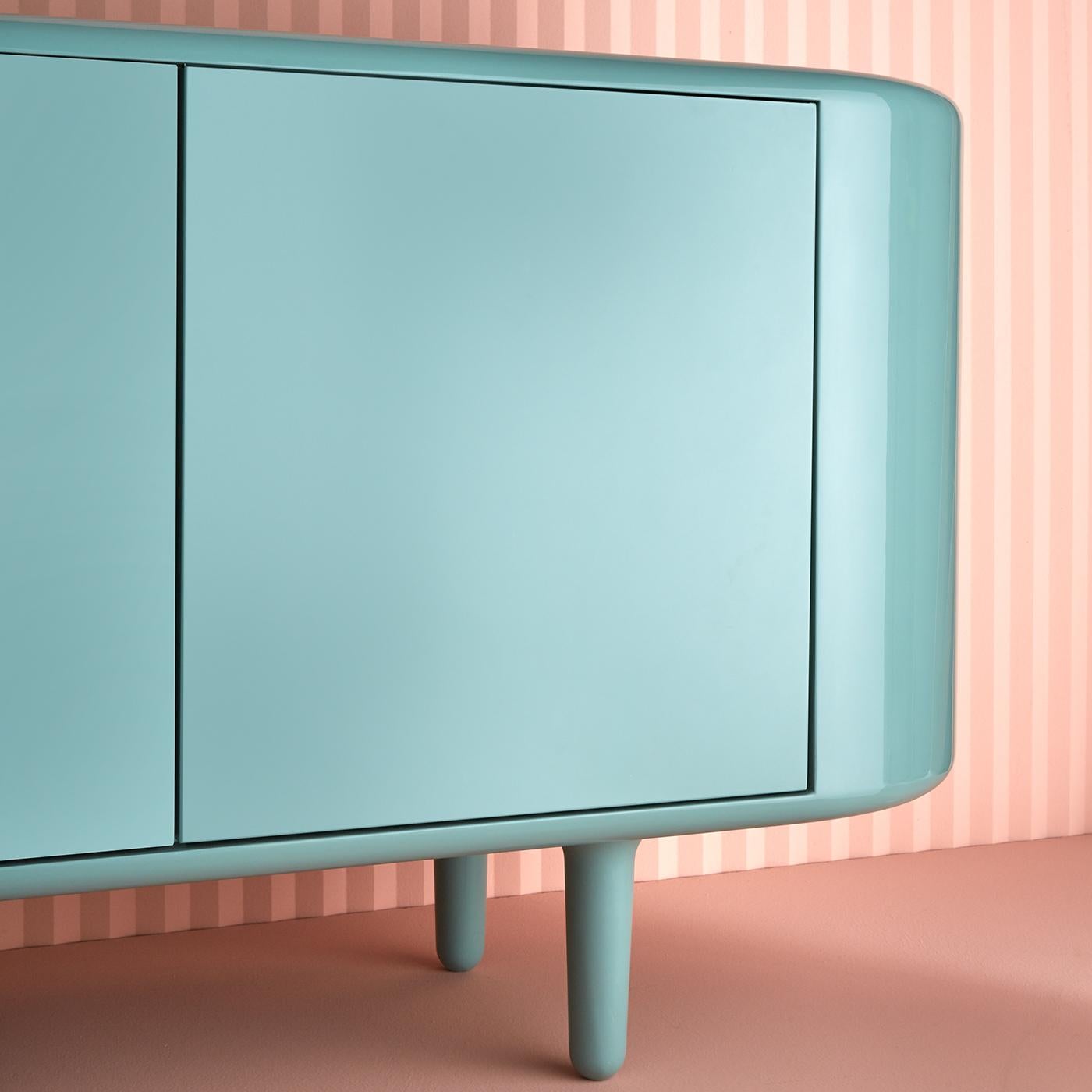 The distinctive design of the famous Italian high-speed express train ETR 300 (aka Settebello) is the inspiration behind this cabinet, whose well-balanced proportions and soft, rounded lines are the perfect fit for a modern home. Supported by four