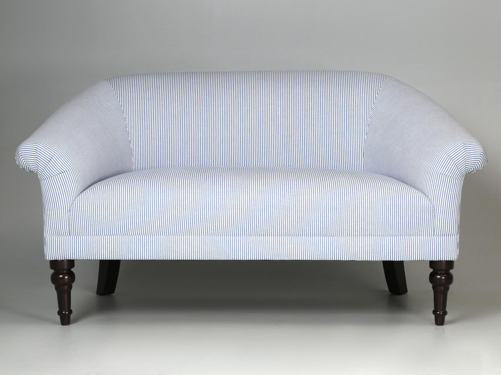 Schumacher seersucker fabric over a modern settee or small sofa.