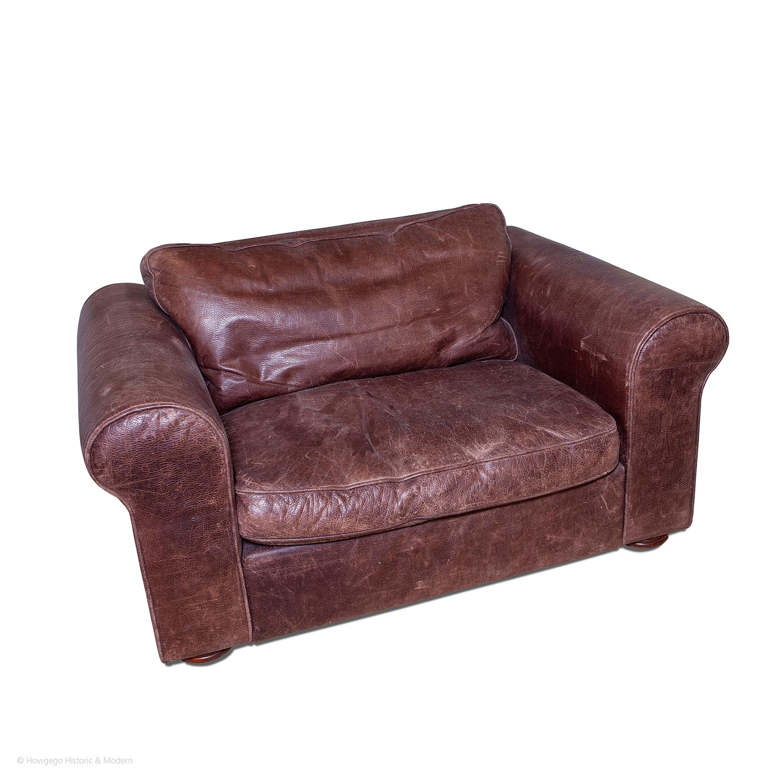 - The low. box form creates a relaxed, comfortable, versatile aesthetic blending with contemporary, modern, country house, club interiors and many more.
- Upholstered in a hard-wearing, brown leather which has a soft aged patina, child and pet