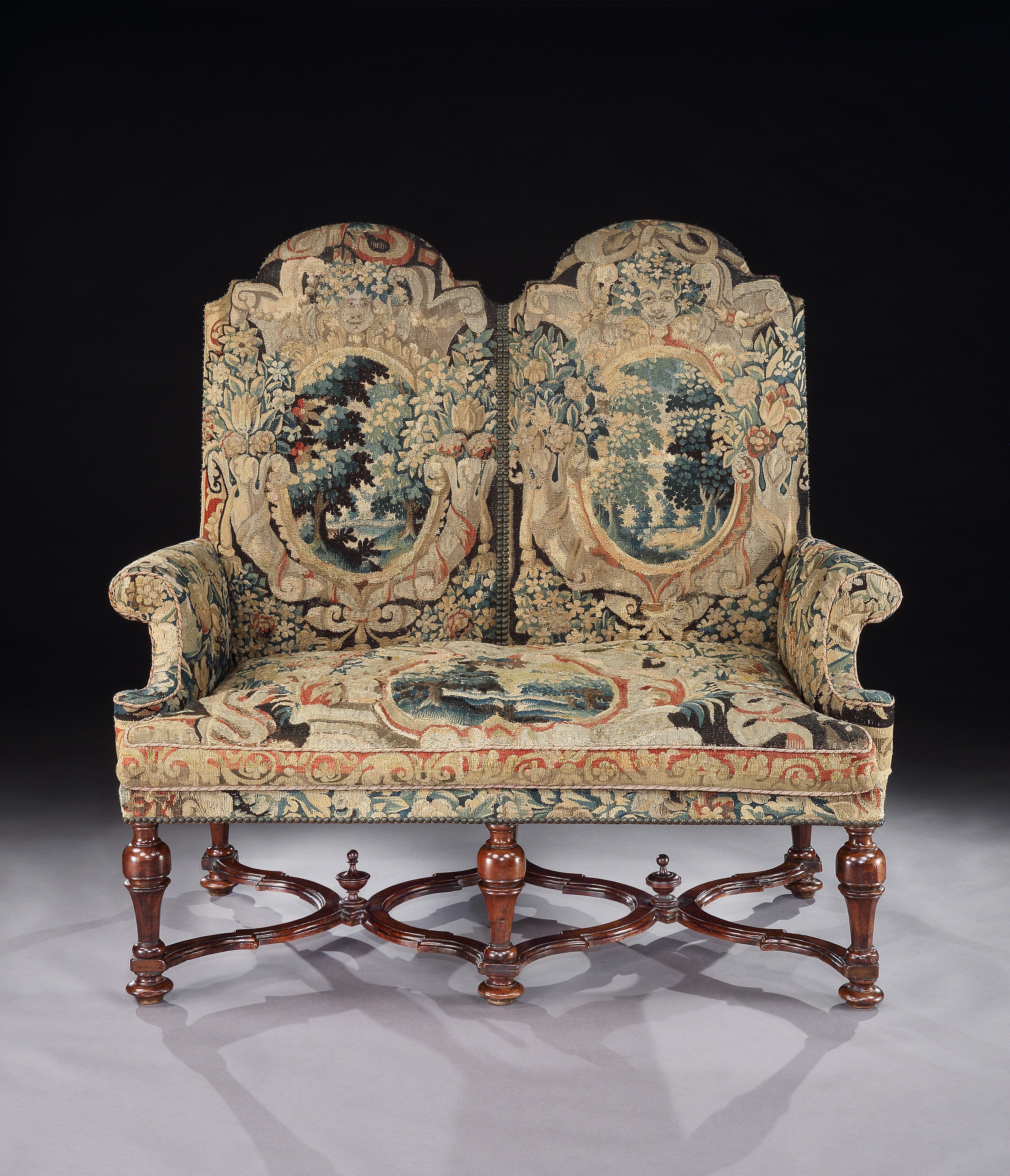 An exceptionally, rare, transitional, double-chair, settee, circa 1700, upholstered in fine, 17th century century Brussels tapestry

Just purchased, more information and images available soon.

- From the 1690s upholstered settees formed part of the