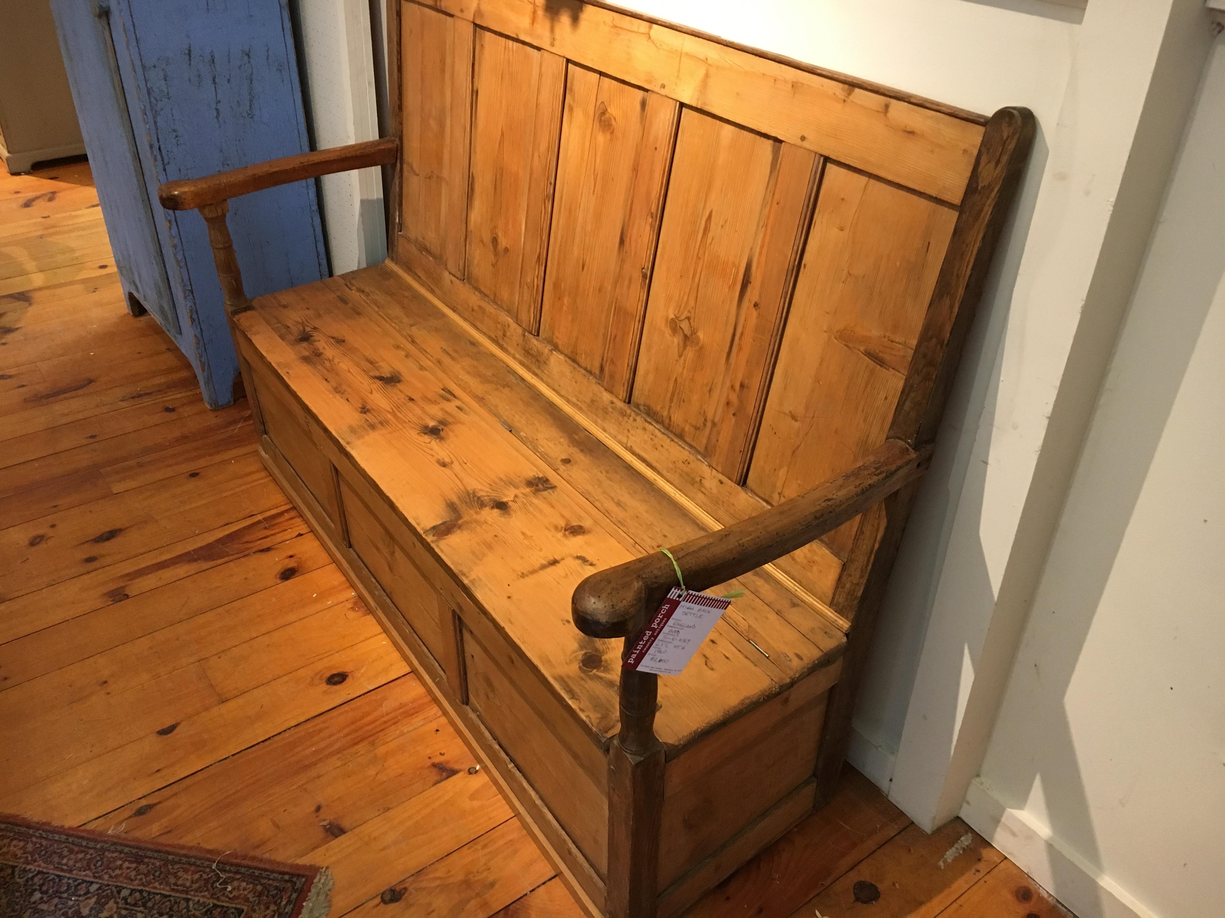 This came from a pub in the south of the United Kingdom and would be perfect in a mud room because the seat lifts up creating plenty of storage. It is in excellent condition and the arms are stunning! A very useful bench in any room in your home.