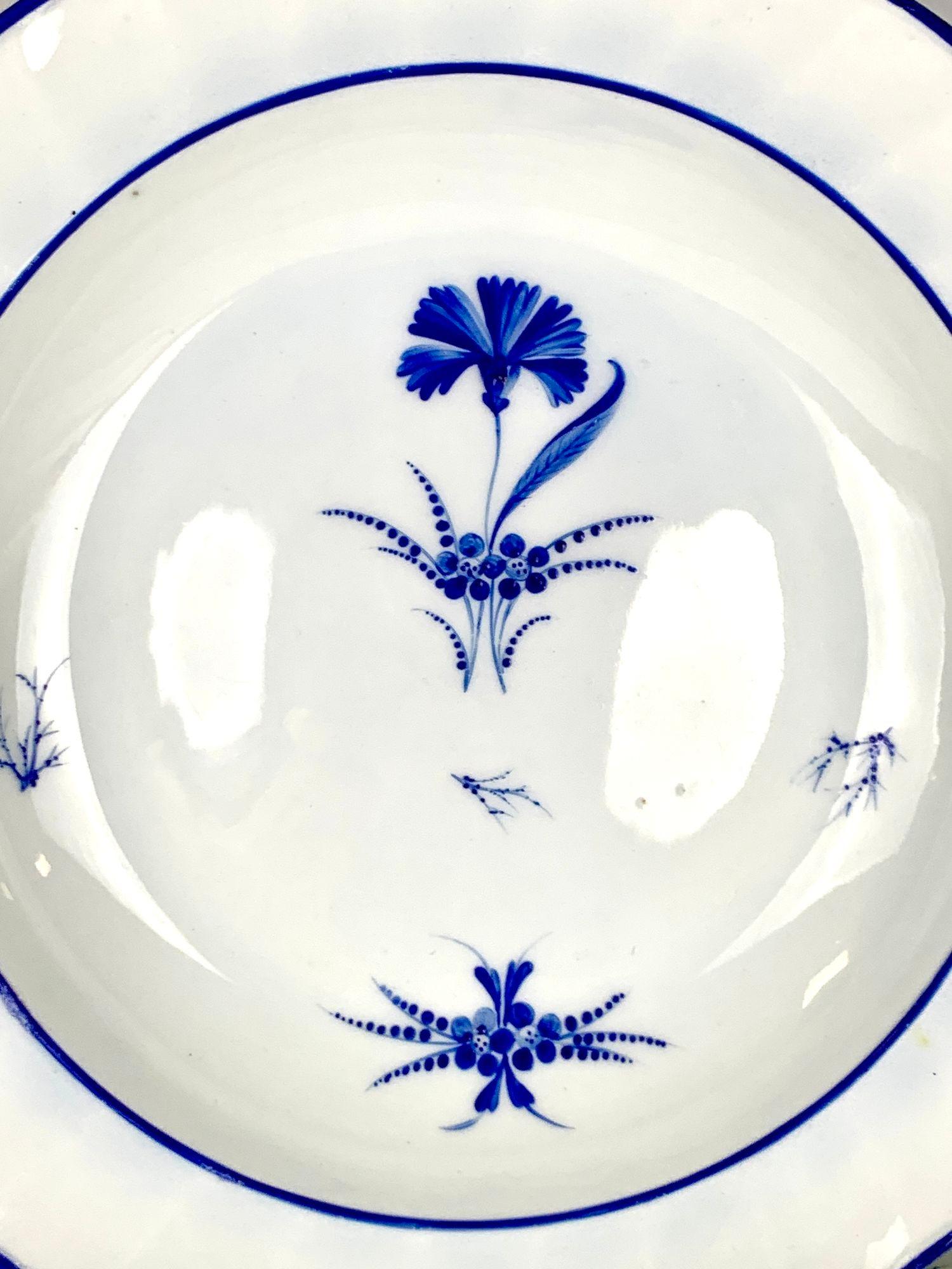 These seven blue and white seven soup dishes are elegant.
They were made by Derby Porcelain at the Nottingham Road factoryin Derbyshire, England, circa 1805, and have the Derby mark of the period.
The Derby Porcelain painters used overglaze blue in
