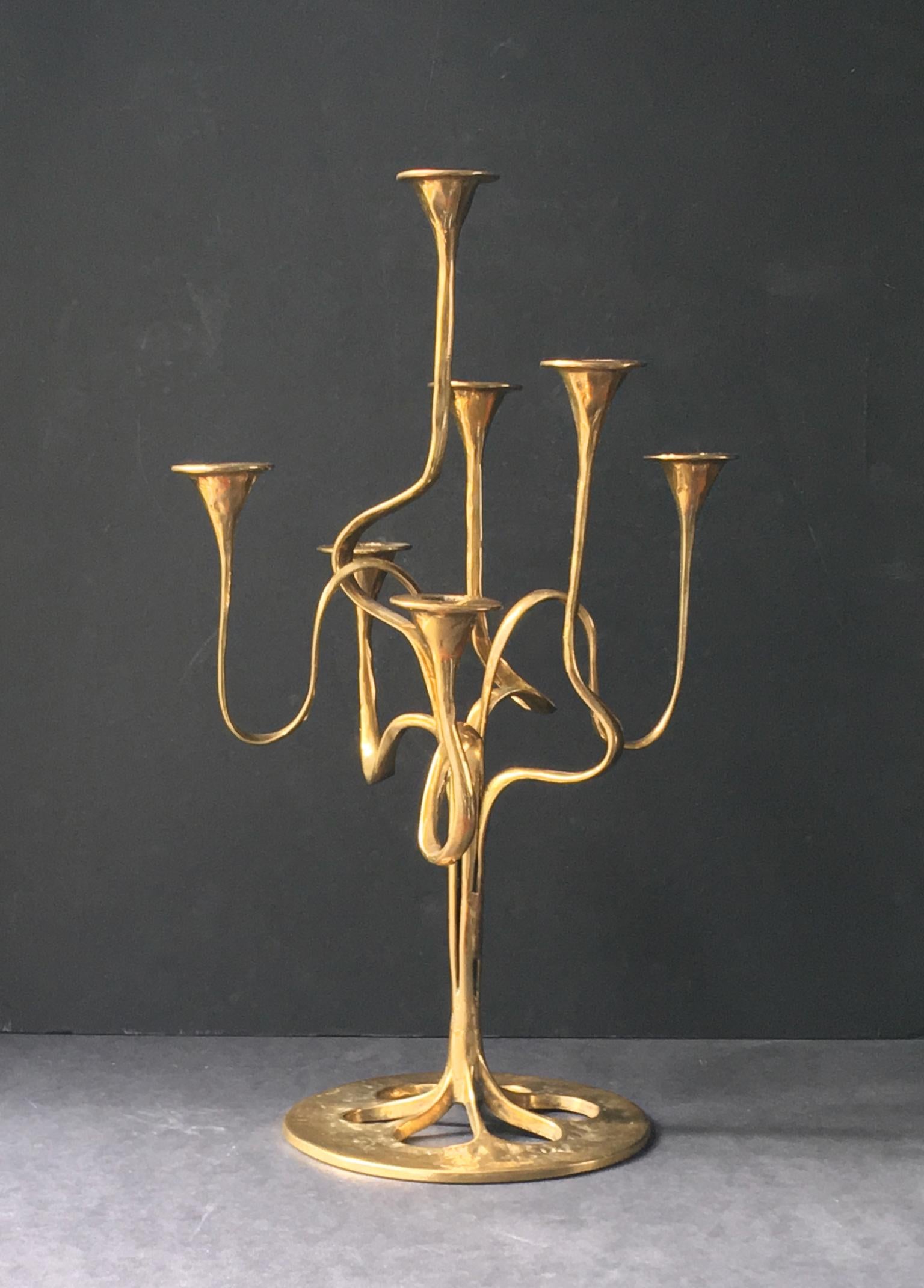 *** Summer sale: special prices on selected pieces until 31 August ***

Candlestick or candelabra with seven arms of organic, ribbon form, evoking Art Nouveau style. 

The piece is composed of polished brass and is in good original condition with