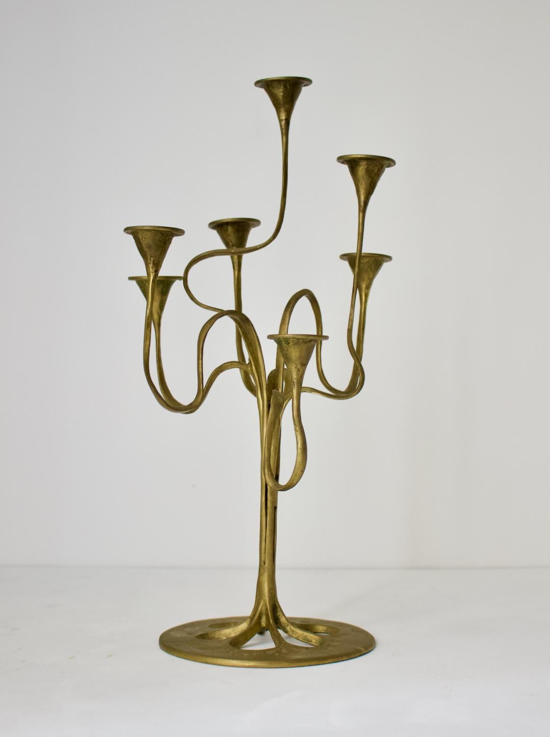 Candlestick or candelabra with seven arms of organic, ribbon form. Second half 20th century in Art Nouveau style. 

Good original condition with a nice aged patina, left as found. Minor signs of age and use, including small spots of oxidation and