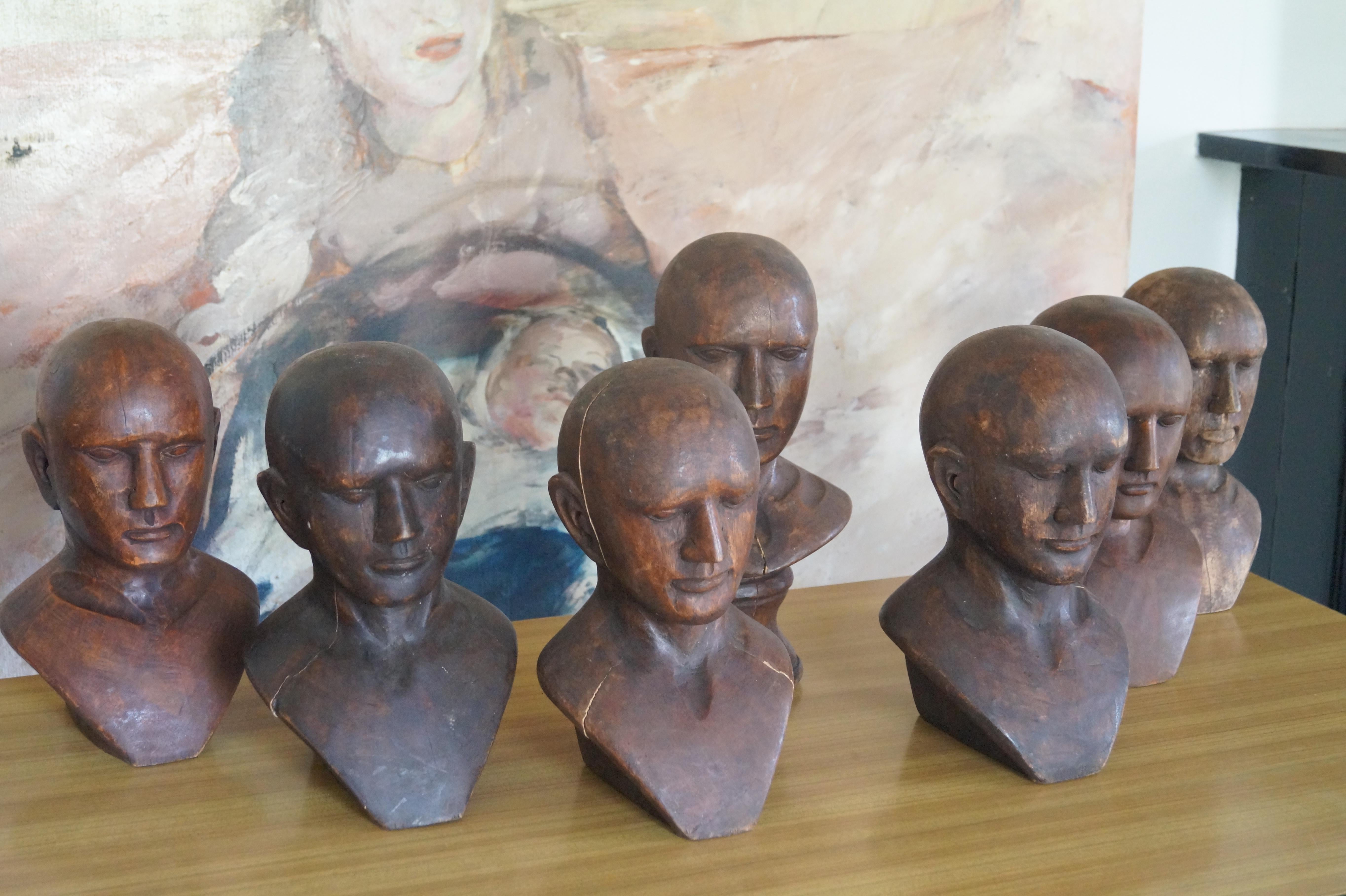 French Seven Art Deco Oak Display Heads. France, 1930s