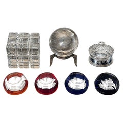 Seven Baccarat Pieces Including Crystal Paperweights and Sirius Crystal Sphere