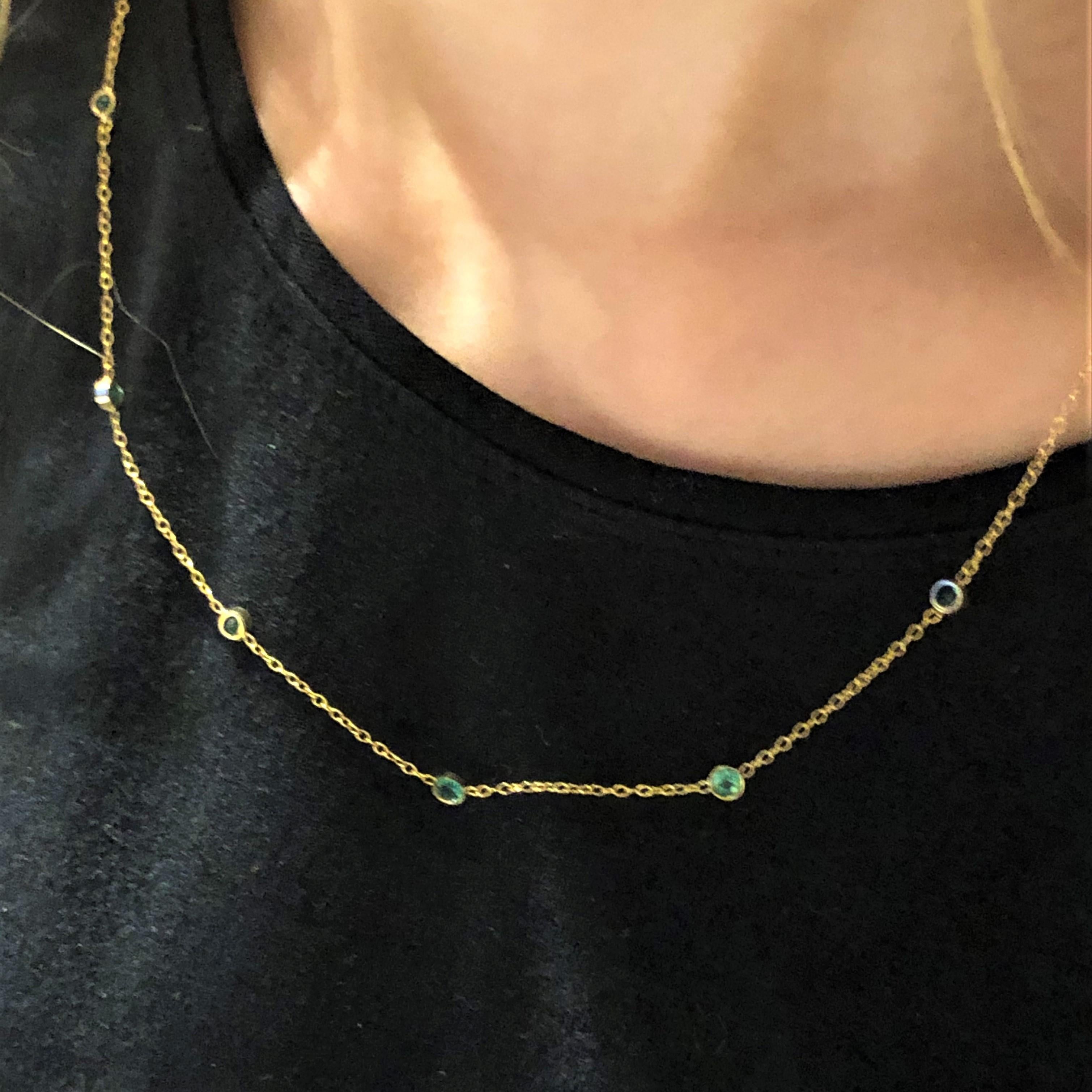 Contemporary Seven Bezel-Set Emerald in Yellow Gold Necklace Weighing 1.15 Carat