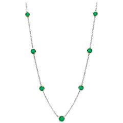 Seven Bezel-Set Round Emerald Yellow and White Gold Necklace Weighing 1.20 Carat