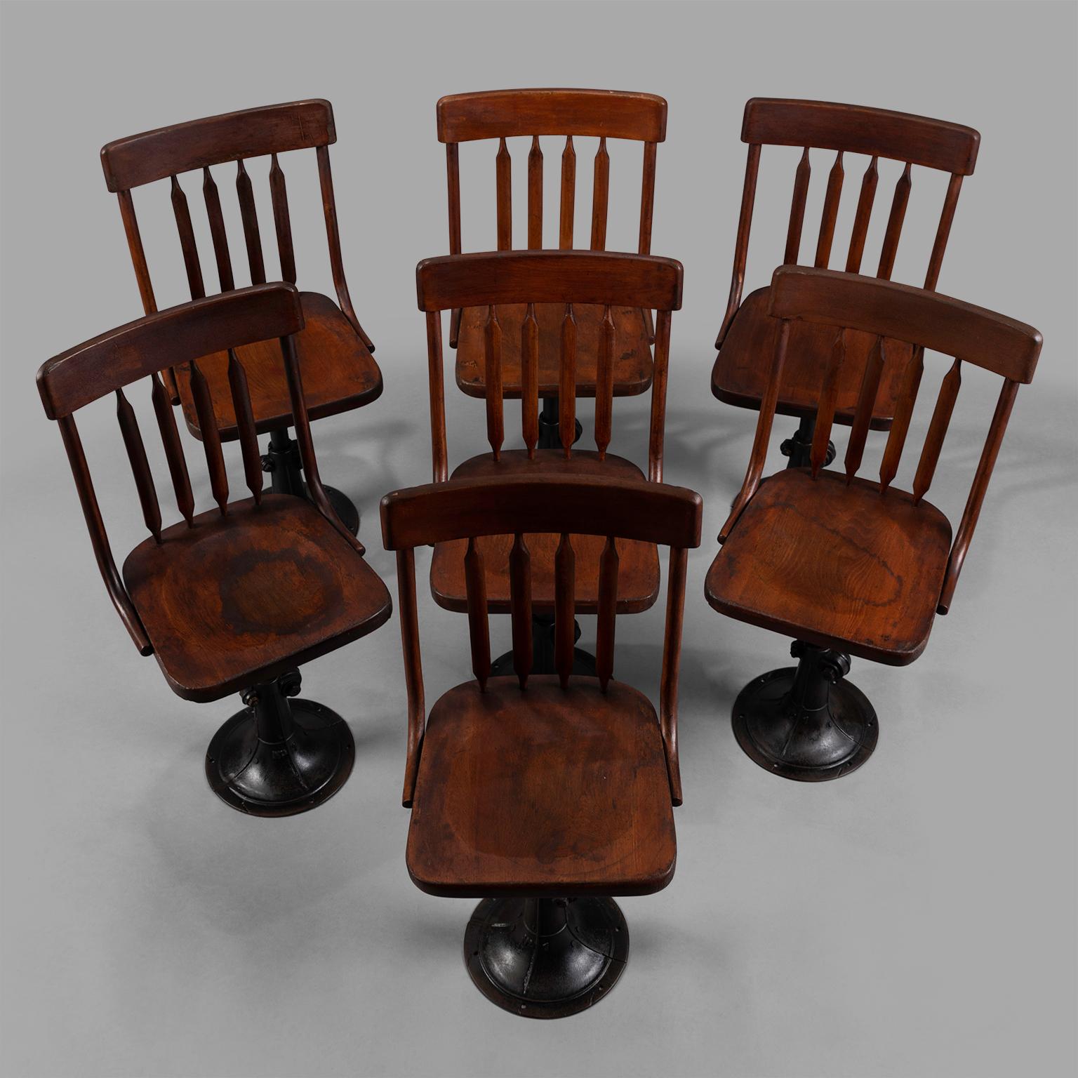 American Seven Cast Iron and Wood Adjustable Height Chairs, circa 1895 For Sale