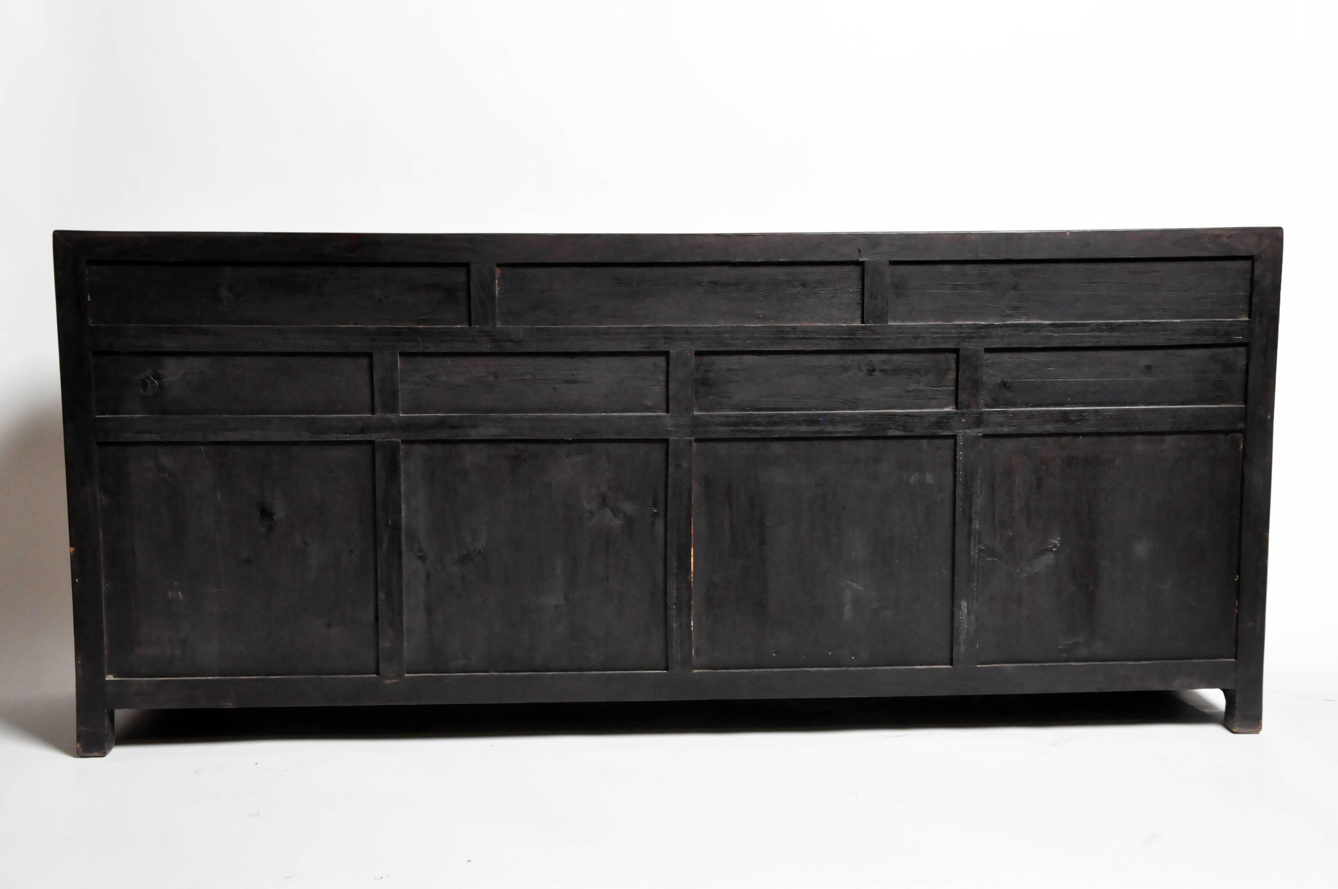 This handsome sideboard is from Hebei, China and was made from reclaimed elm wood. The piece features mortise and tenon joinery, seven drawers, and a shelf for additional storage. You can also customize it and make your own. Wood, color, finish, and