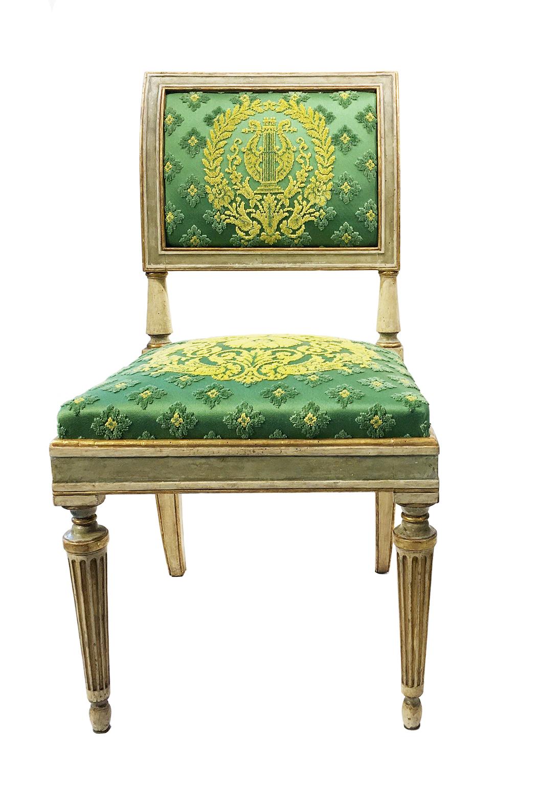 Group of seven chairs
Milan, first quarter of the 19th century
Carved walnut wood, lacquered in gray green and cream and partially gilded
They measure:
height 36.61 in (18.11 in to the seat) x 19.29 in x 19.68 
(height 93 cm – 46 cm to the seat