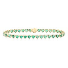 Bracelet de tennis en or jaune 14K (ou 18k sur demande) avec sept émeraudes et diamants