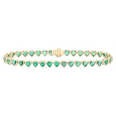 Bracelet de tennis en or jaune 14K (ou 18k sur demande) avec sept émeraudes et diamants