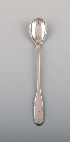 Seven Evald Nielsen Number 14 Iced Tea Spoons in Hammered Silver, 1920s.