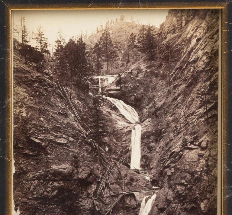 Presented is an antique photographic postcard of Seven Falls, Colorado, from 1880. Postcard production blossomed in the late 1800s and early 1900s, as railroads opened up much of the Western frontier to new and exciting travel opportunities.