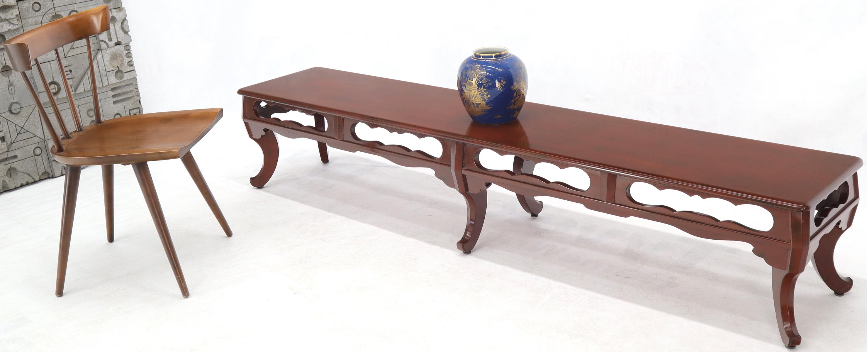 Decorative seven foot long carved frame bench or coffee table in thick dirty red lacquer enamel finish.