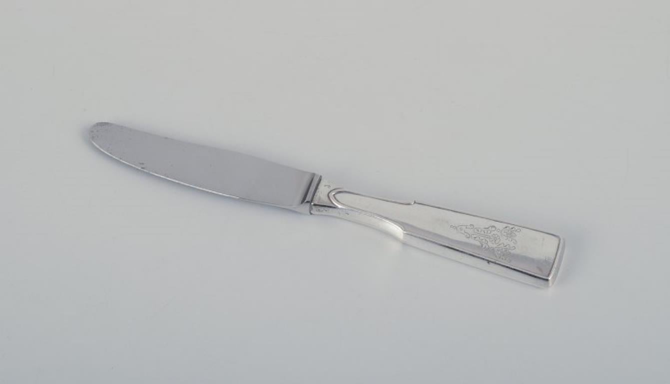 Cohr and other Danish silversmiths. Seven fruit knives in sterling silver with stainless steel blades. 
Art Nouveau and Art Deco styles.
All knives with Danish silver hallmarks.
In excellent condition.
1930s - 1950s.
Dimensions: L 12.5 cm - 17.5 cm.