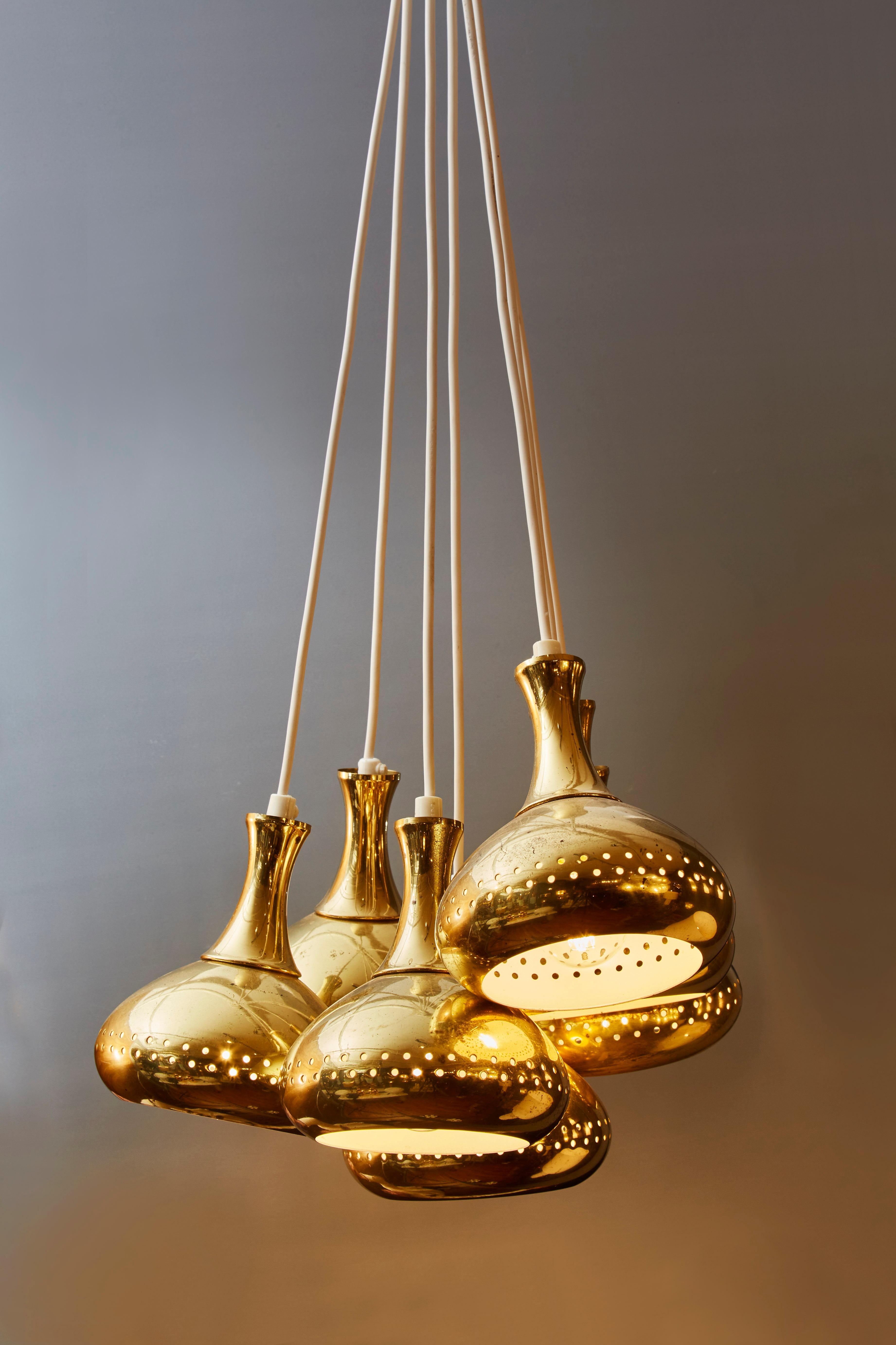 Seven individual pendants designed by Hans Agne Jakobsson in the 1950s.

Each are made of perforated brass and are newly rewired.