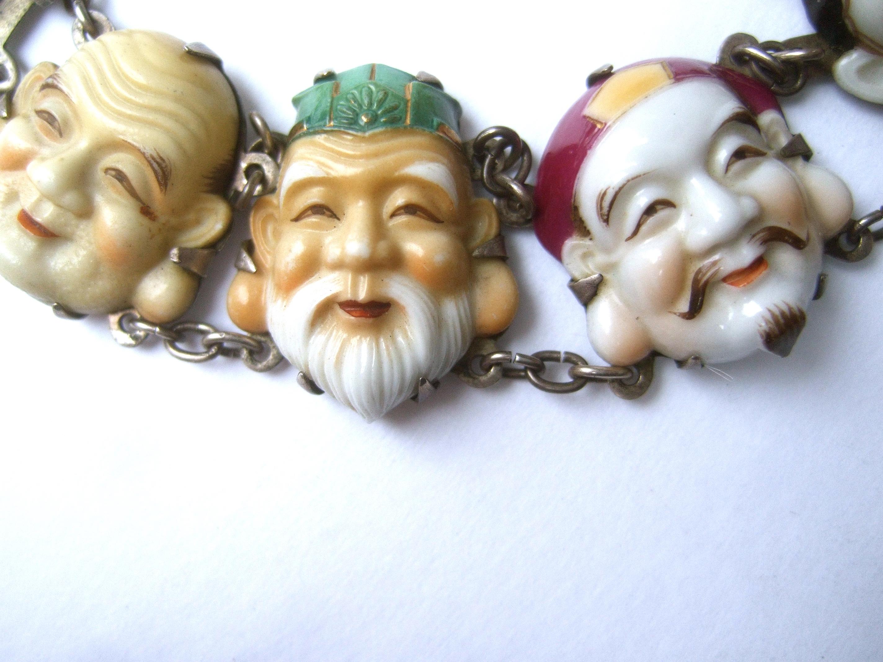 Artisan Seven Immortal Lucky Gods of Japan Sterling & Porcelain Figural Bracelet c 1950s For Sale