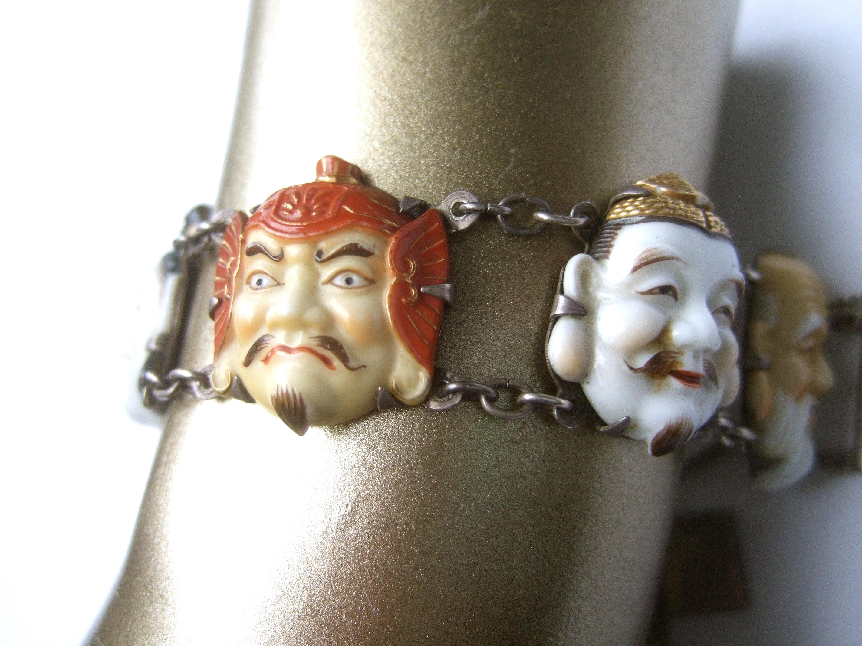 Women's Seven Immortal Lucky Gods of Japan Sterling & Porcelain Figural Bracelet c 1950s For Sale