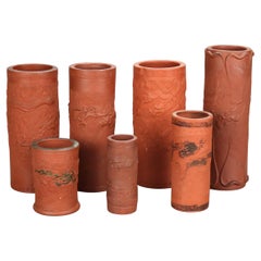 Seven Japanese Embossed Terra Cotta Vases C1930