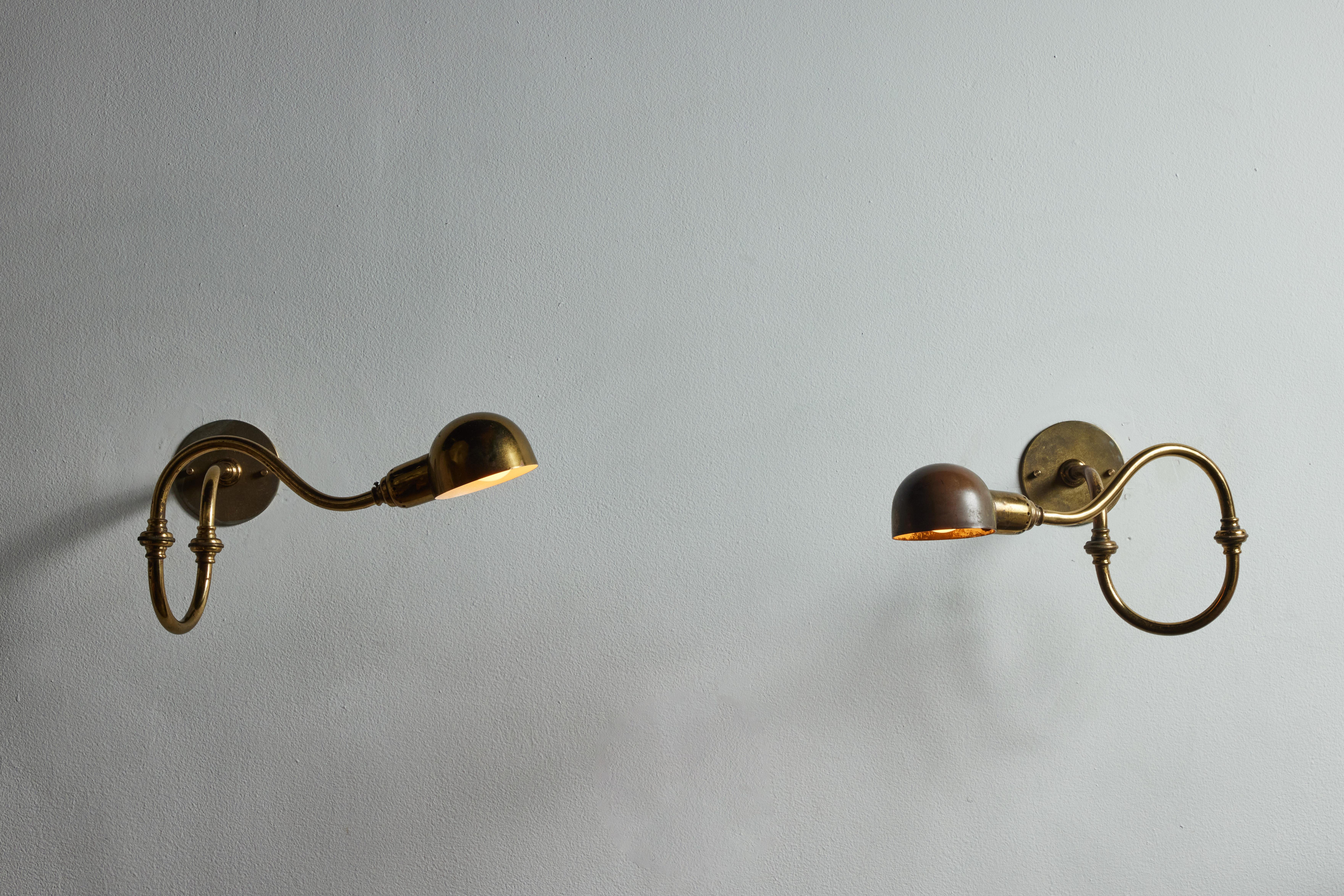 Single LP15 tromba sconce by Luigi Caccia Dominioni for Azucena. Designed and manufactured in Italy, 1964. Brass, custom brass backplate. Rewired for U.S. 
standards. Arms and shades adjust to various positions. Light takes one E27 75W maximum bulb.