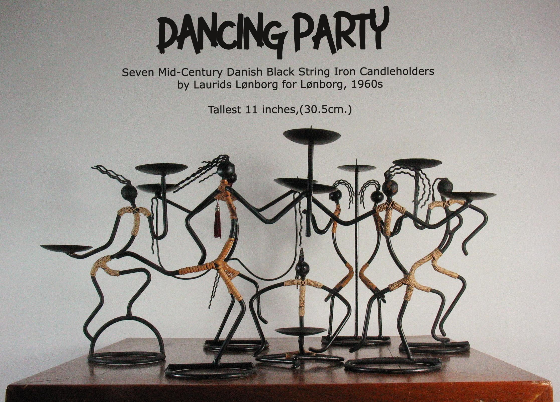 Seven Mid-Century Modernist Danish Black String Iron Candleholders 