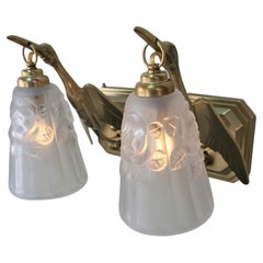 Seven Pairs of Art Deco Bronze and Glass Flying Bird Wall Sconce by Degue