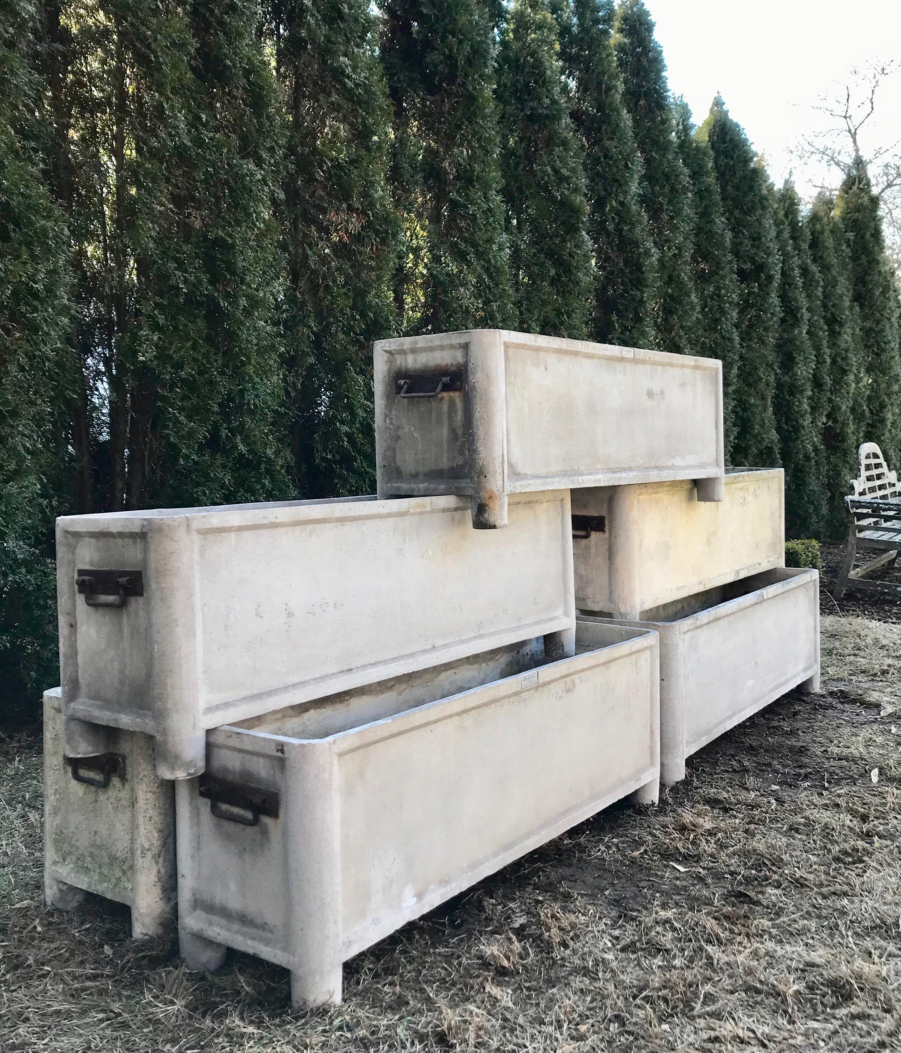 We love these rectangular planters with iron handles for their size, versatility and lightly patinated surface that blends with everything in the garden. Commodious in size, these will accommodate most any plantings but are particularly lovely with