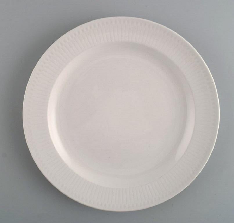 Seven Rörstrand porcelain plates. Swedish Grace. 
Mid-20th century.
Diameter: 21 cm.
In excellent condition.
Stamped.
1st factory quality.