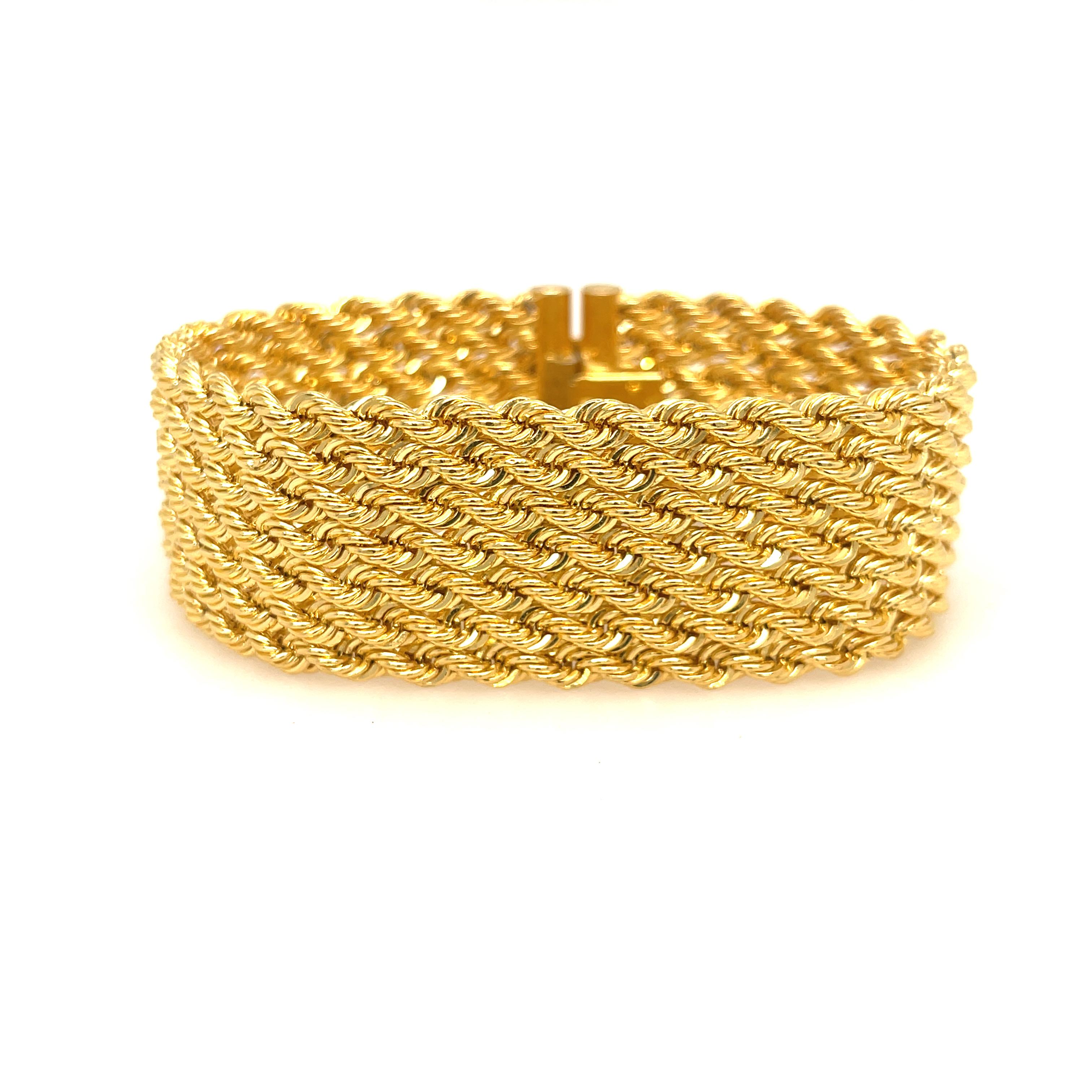 Seven Row Rope Bracelet in 18K Yellow Gold. 

1 inch wide
7.5 inches length
40 grams