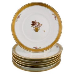 Sept assiettes à déjeuner en porcelaine panier doré Royal Copenhagen