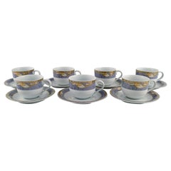 Seven Royal Copenhagen Gray Magnolia Coffee Cups with Saucers in Porcelain