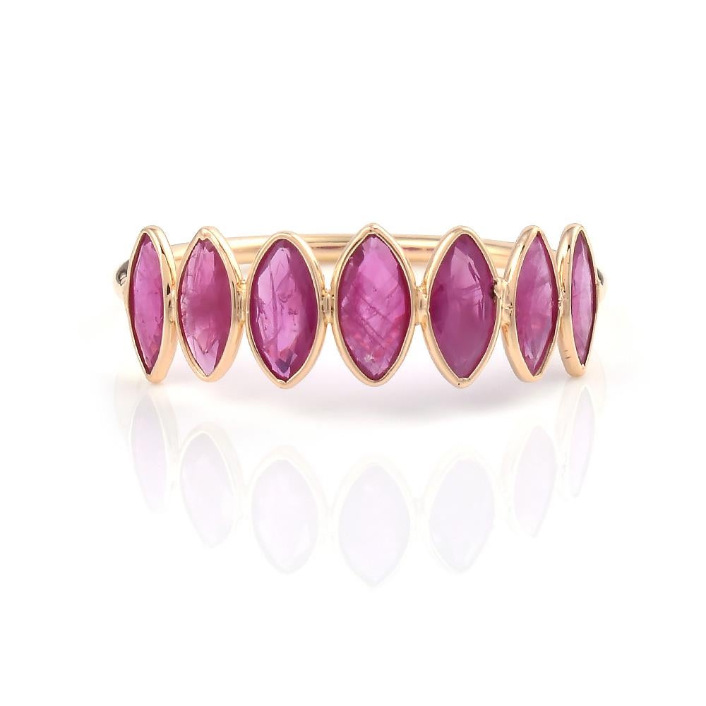 A Seven Ruby Marquise Shape Ring Band made in 18 Karat Yellow Gold. The total weight of the rubies is 1.65 carats. The total weight of the ring is 1.24 grams. Ring Size US 7.25. 
