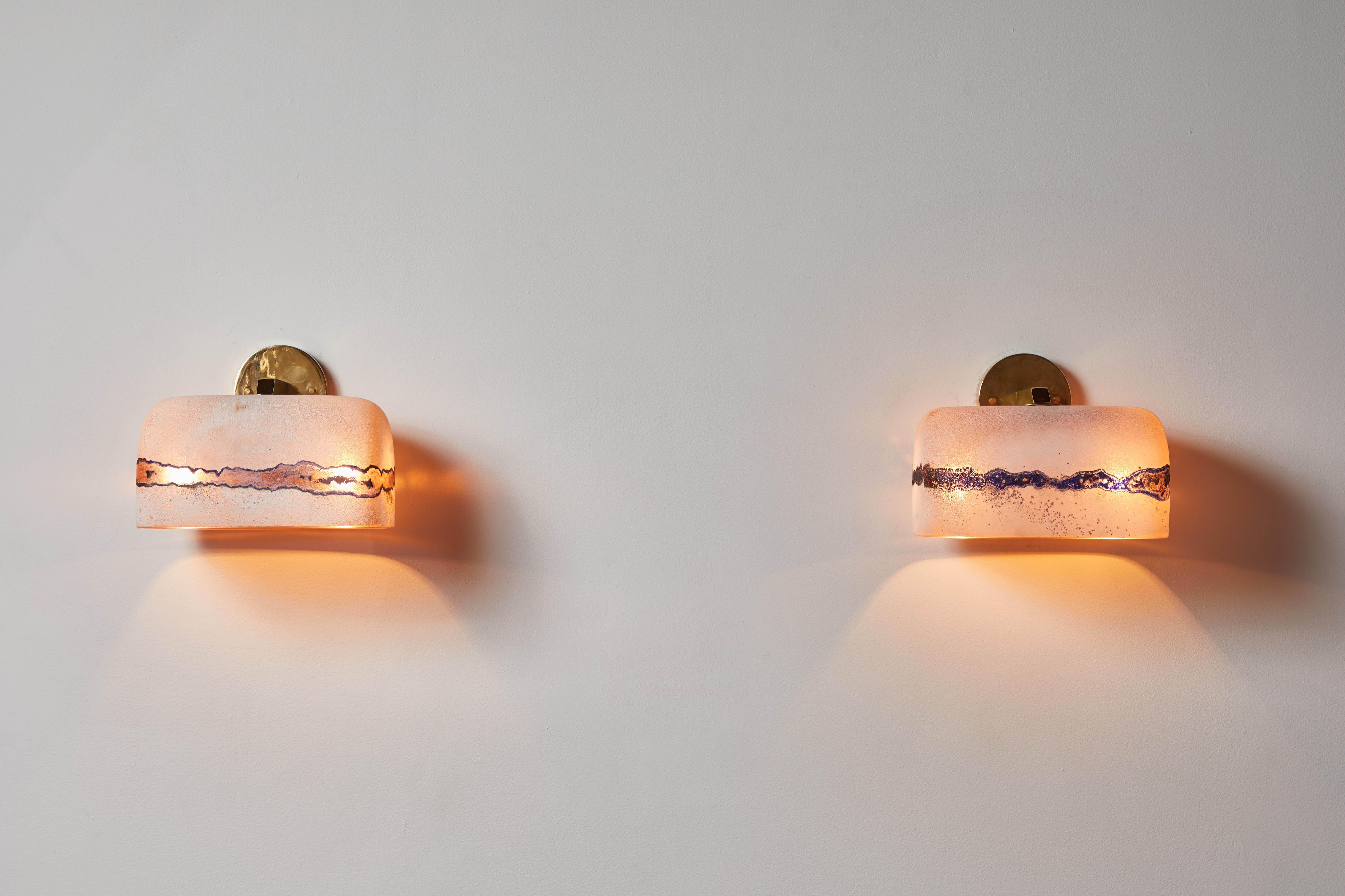 One sconce by Alfredo Barbini. Designed and manufactured in Italy, circa 1960's. Murano Scavo glass and brass. Rewired for U.S. standards. Each light takes one bulb E27 60w candelabra bulb. Bulbs provided as a onetime courtesy. Priced and sold